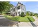 Townhouse exterior featuring modern design, manicured lawn, and inviting curb appeal at 6300 Pleasant Pines Dr # 101, Raleigh, NC 27613
