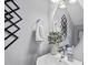 Stylish half-bath with sleek fixtures and decorative art at 6300 Pleasant Pines Dr # 101, Raleigh, NC 27613