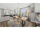 Bright, open-concept living and dining area featuring modern furnishings and ample natural light at 6300 Pleasant Pines Dr # 101, Raleigh, NC 27613