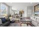 A bright, spacious living room flowing into the kitchen and dining areas at 6300 Pleasant Pines Dr # 101, Raleigh, NC 27613