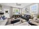 This living room is spacious, bright and cozy with a TV at 6300 Pleasant Pines Dr # 101, Raleigh, NC 27613