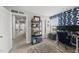 Home office with blue accent wall, dual monitors, and a view into the hallway at 6300 Pleasant Pines Dr # 101, Raleigh, NC 27613