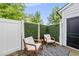 Private patio area features outdoor seating and a decorative green wall at 6300 Pleasant Pines Dr # 101, Raleigh, NC 27613