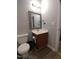 Bathroom features a vanity, toilet, and framed mirror with lighting at 650 Ganyard Farm Way # 32, Durham, NC 27703