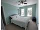 Light and airy bedroom features a ceiling fan, neutral walls, and lots of natural light at 650 Ganyard Farm Way # 32, Durham, NC 27703