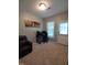 Bedroom with gray walls, carpeted floor, and door to exterior at 650 Ganyard Farm Way # 32, Durham, NC 27703