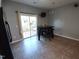 Bright dining area with sliding glass doors and a modern chandelier for additional lighting at 650 Ganyard Farm Way # 32, Durham, NC 27703