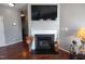 Living room featuring fireplace with decorative vases and lighting, hardwood floors at 650 Ganyard Farm Way # 32, Durham, NC 27703