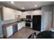 Well-lit kitchen features stainless steel appliances, white cabinets and lots of counter space at 650 Ganyard Farm Way # 32, Durham, NC 27703