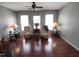 Bright living room boasts hardwood floors, neutral palette, and large windows at 650 Ganyard Farm Way # 32, Durham, NC 27703