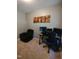 Cozy home office features black furniture and decor with carpet flooring at 650 Ganyard Farm Way # 32, Durham, NC 27703