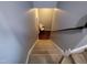 Carpeted staircase with gray walls and lighting, leading to a lower level at 650 Ganyard Farm Way # 32, Durham, NC 27703
