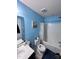 Bathroom with a blue theme, featuring a shower-tub combo and a modern sink at 651 Berry Chase Way, Cary, NC 27519
