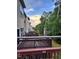 A view from the upper deck showing its painted wooden railing and the wooden fence running along the back of the properties at 651 Berry Chase Way, Cary, NC 27519