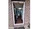 Inviting entryway of a brick home with a dark wood door and neutral interior at 651 Berry Chase Way, Cary, NC 27519
