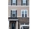 Detail of the home's exterior showing layered siding, dark shutters, and house number at 651 Berry Chase Way, Cary, NC 27519