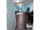 Living room with laminate wood flooring, blue walls, and a sliding glass door at 651 Berry Chase Way, Cary, NC 27519