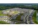 Wide aerial shot of a neighborhood showcasing community amenities including a pool and green spaces at 706 Ambrose Hill Lane Ln, Wendell, NC 27591
