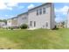 The backyard has lush green grass and a concrete patio, providing ample space for recreation at 706 Ambrose Hill Lane Ln, Wendell, NC 27591
