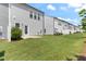 The backyard has lush green grass and a concrete patio, providing ample space for recreation at 706 Ambrose Hill Lane Ln, Wendell, NC 27591