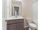 Bathroom features a stylish vanity, modern fixtures, and tiled shower-tub combo at 706 Ambrose Hill Lane Ln, Wendell, NC 27591