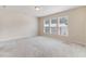 Bright and airy bedroom featuring large windows and plush carpeting at 706 Ambrose Hill Lane Ln, Wendell, NC 27591