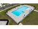 Aerial view of a refreshing community pool with ample seating and umbrella-shaded tables at 706 Ambrose Hill Lane Ln, Wendell, NC 27591