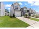 Attractive townhome exteriors with landscaped front yards and attached garages at 706 Ambrose Hill Lane Ln, Wendell, NC 27591