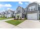 Charming new construction homes showcasing modern exteriors, garages, and well-maintained lawns at 706 Ambrose Hill Lane Ln, Wendell, NC 27591