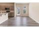 Bright kitchen area featuring wood-look floors and stainless appliances at 706 Ambrose Hill Lane Ln, Wendell, NC 27591