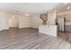 Spacious living area showcasing wood-look floors and a well-designed open floor plan at 706 Ambrose Hill Lane Ln, Wendell, NC 27591