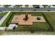 Aerial view of a fenced community playground offering a fun and safe recreational space at 706 Ambrose Hill Lane Ln, Wendell, NC 27591