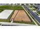 Aerial photograph of the community volleyball court with benches, surrounded by a secure fence at 706 Ambrose Hill Lane Ln, Wendell, NC 27591