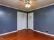 Bedroom with hardwood floors, closet, and door at 712 E Horne St, Clayton, NC 27520