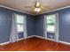 Bedroom with hardwood floors, neutral walls, and bright natural light at 712 E Horne St, Clayton, NC 27520