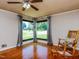 Bright living room with hardwood floors, large windows, and a rocking chair at 712 E Horne St, Clayton, NC 27520