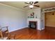 Cozy living room with hardwood floors and a classic brick fireplace at 712 E Horne St, Clayton, NC 27520