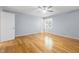Bedroom with hardwood flooring, a ceiling fan, and natural light from the window at 716 Sandra St, Garner, NC 27529