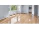 Light-filled bedroom with bay window and hardwood floors at 716 Sandra St, Garner, NC 27529