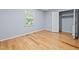 Cozy bedroom featuring hardwood floors, natural light, and ample closet space at 716 Sandra St, Garner, NC 27529