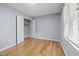 Comfortable bedroom featuring hardwood floors, bright window, and closet at 716 Sandra St, Garner, NC 27529