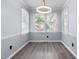 Bright dining room with modern light fixture and neutral decor at 716 Sandra St, Garner, NC 27529