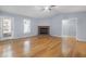 Spacious living room with hardwood floors, fireplace, and natural light at 716 Sandra St, Garner, NC 27529