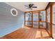 Sun-filled screened-in porch with wood frame and light-blue siding at 716 Sandra St, Garner, NC 27529