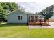 Home with a screened porch and a well-maintained lawn at 716 Sandra St, Garner, NC 27529