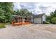 Home featuring a screened porch and a paved driveway at 716 Sandra St, Garner, NC 27529