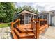 Spacious screened porch with wood railing offering an outdoor entertaining space at 716 Sandra St, Garner, NC 27529