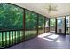 Screened porch featuring wood flooring and backyard views perfect for enjoying the outdoors in comfort at 74 Fountain Dr, Clayton, NC 27520