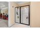 Glass enclosed shower with tile in a bright bathroom at 74 Fountain Dr, Clayton, NC 27520