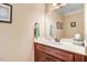 Bathroom featuring a wooden vanity, neutral paint, and a large mirror at 74 Fountain Dr, Clayton, NC 27520